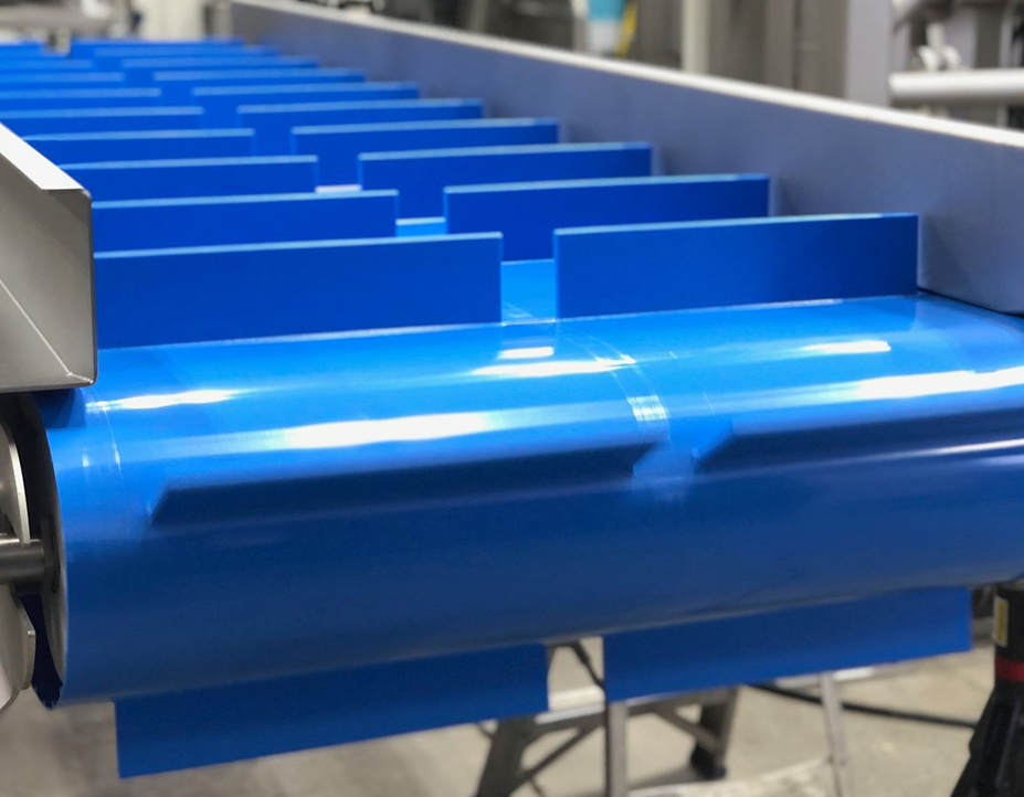 Custom bespoke PVC and PU conveyor belt fabrication with flights and sidewalls